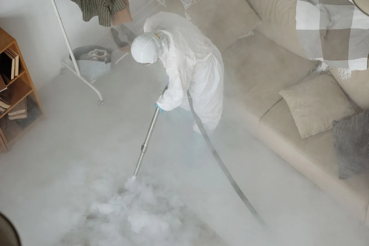 Biohazard cleanup technician in protective equipment, Lewisburg, WV